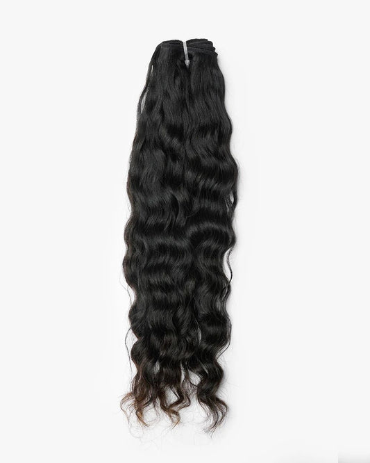 Raw Cambodian wavy hair bundle on white background